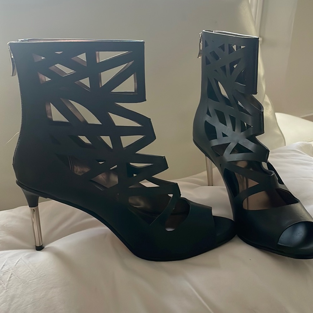 Women’s BCBGeneration ankle boot heels with front toe cut out , size 10.